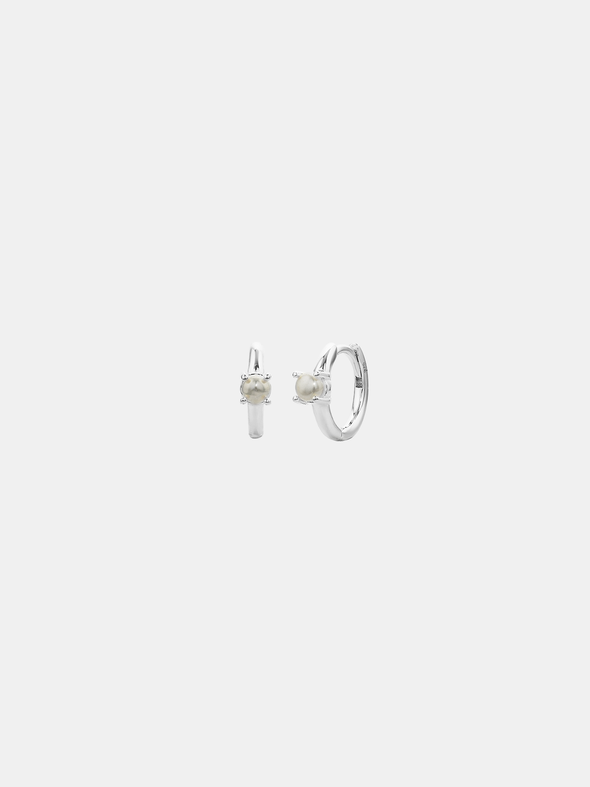Pair of silver hoop earrings with a pearl on a white background