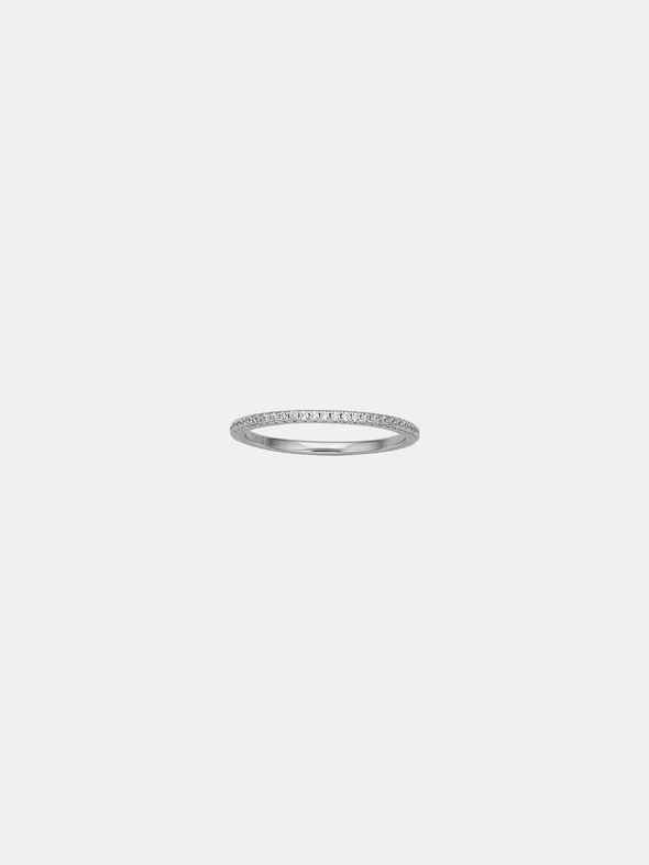 Silver ring with a CZ stones on a light gray background