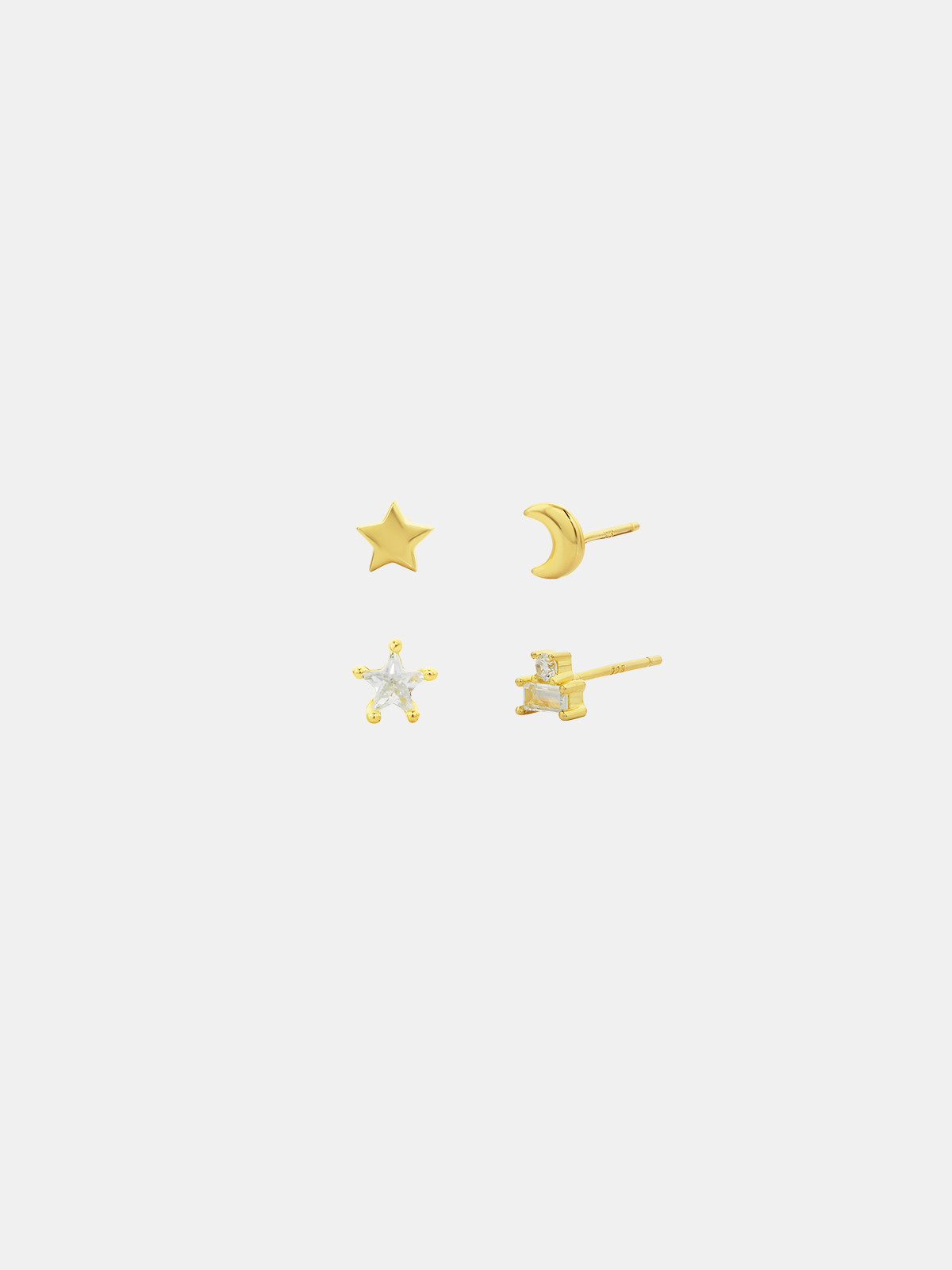 Set of gold earrings including star, moon, and cross designs on a white background