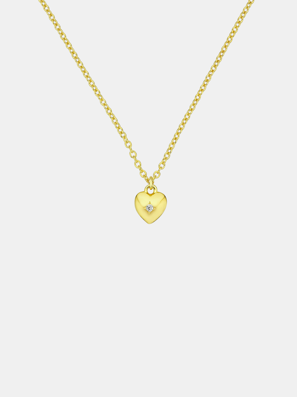 Gold heart-shaped pendant necklace on a light gray background