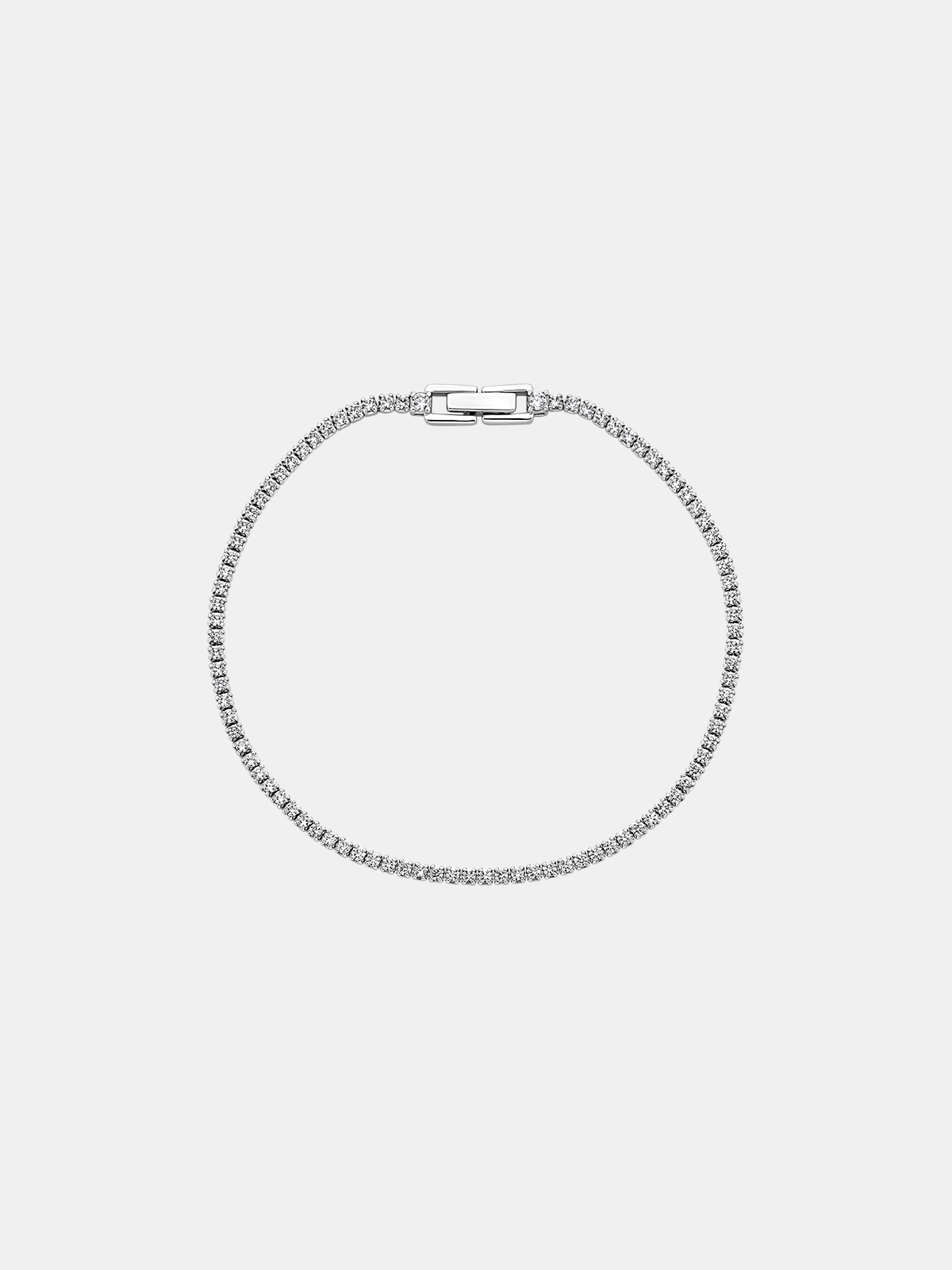 Silver bracelet on a light gray background