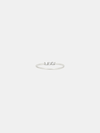 Silver ring with small stones on a light gray background