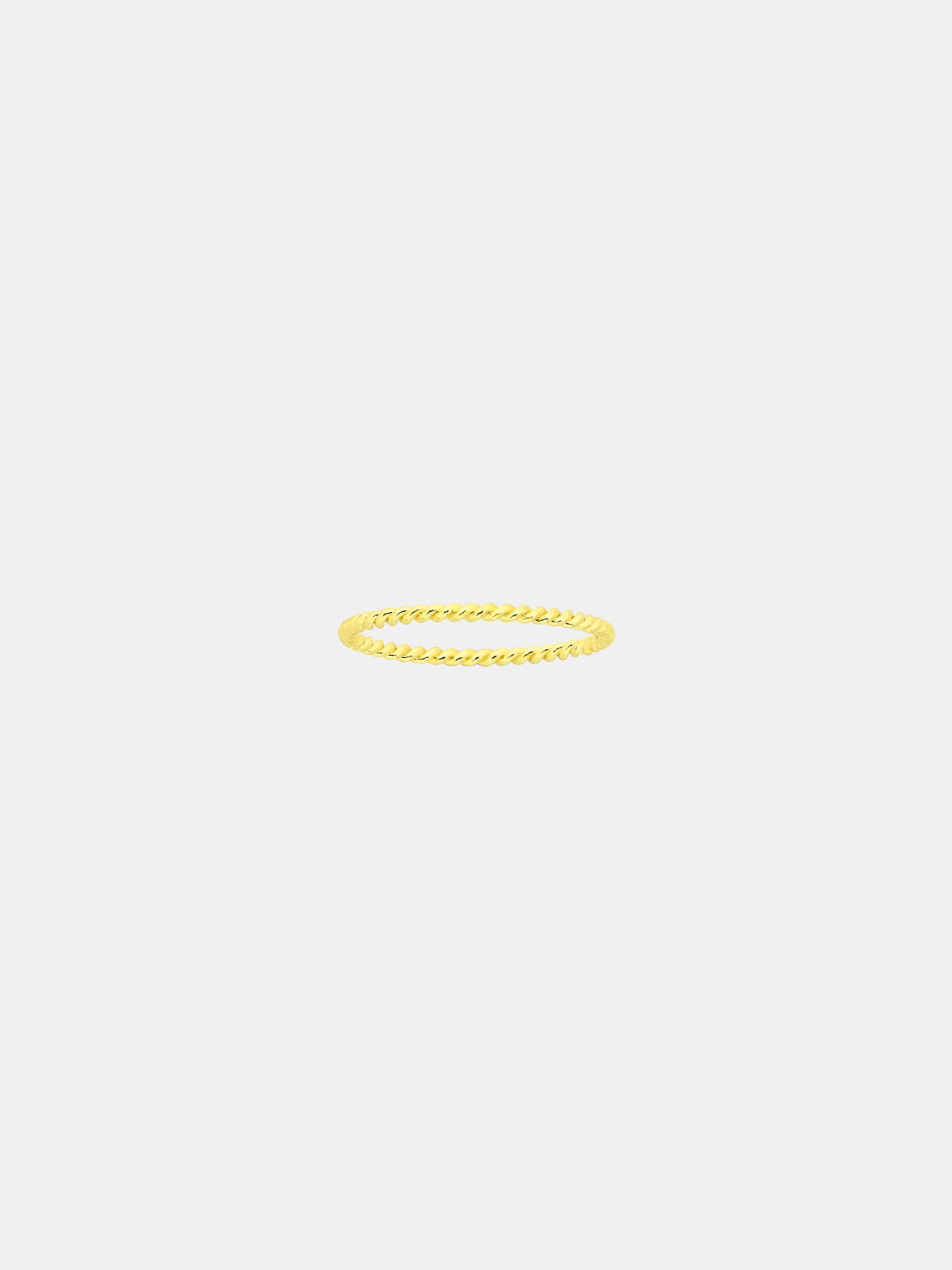 Gold twist ring on a light gray background