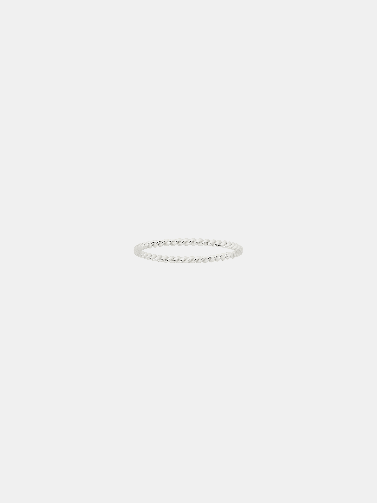 Silver twist ring on a light gray background