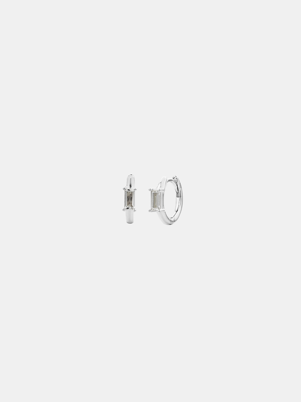 Pair of silver hoop earrings on a light gray background